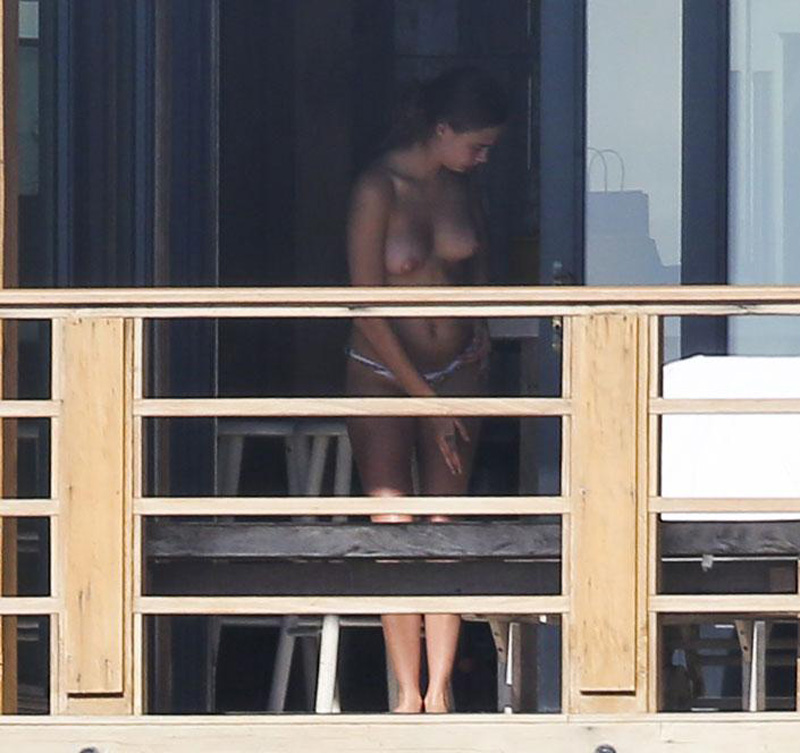 Cara Delevingne Topless Sunbathing on Vacation