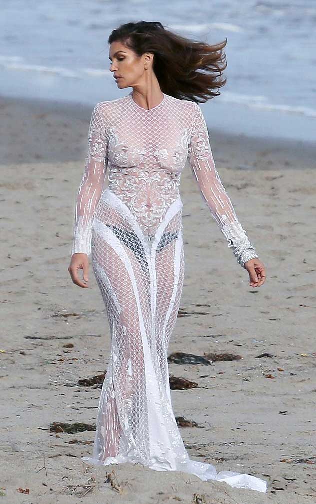 Cindy Crawford Braless in Lace Dress on the Beach