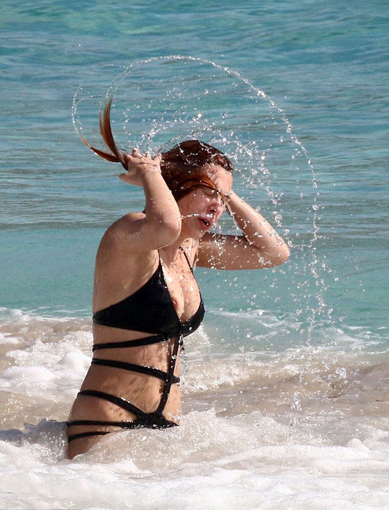 Elena Satine Pops Out a Nipple in the Surf