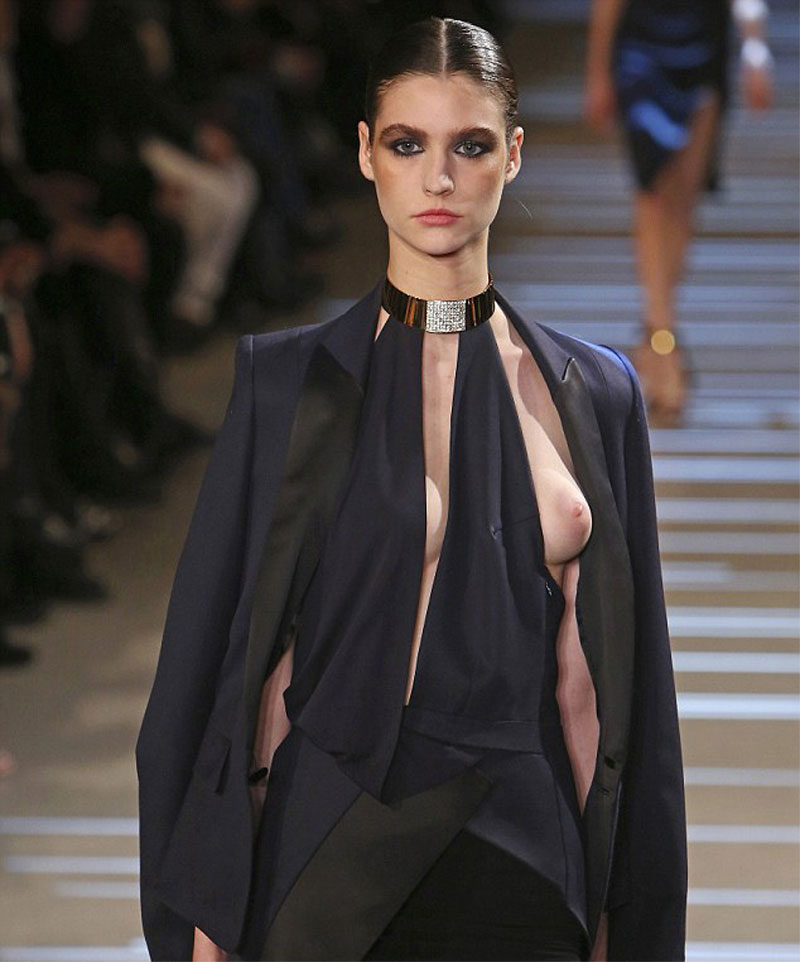 Slender model accidentally slips out her boob and plump nipple in a stylish...
