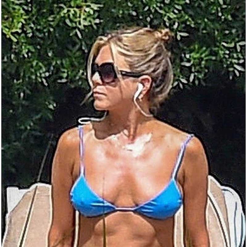 Jennifer Aniston Sunbathing Pokies in Blue Bikini