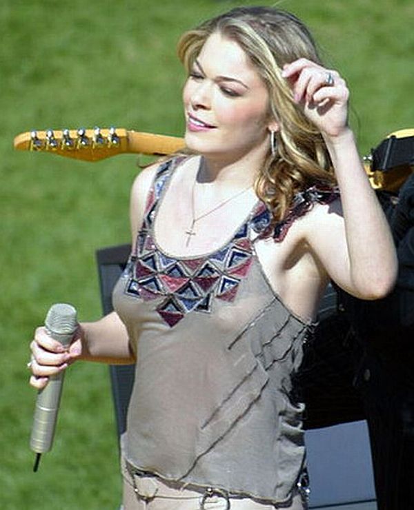 Leanne Rimes performs braless in a slightly see-through grey top that shows...