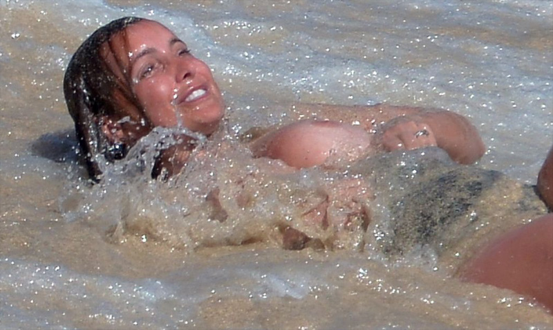Louise Redknapp Loses her Bathing Suit in the Surf