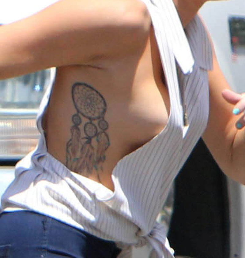 Massive Miley Cyrus Side Boob Action Shot