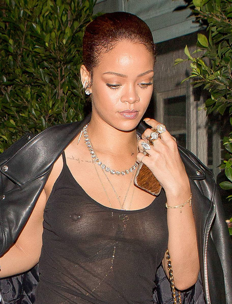 Rihanna Braless in See Through Black Lace Blouse