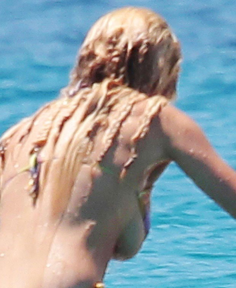 Rita Ora Almost Loses Her Bikini Top