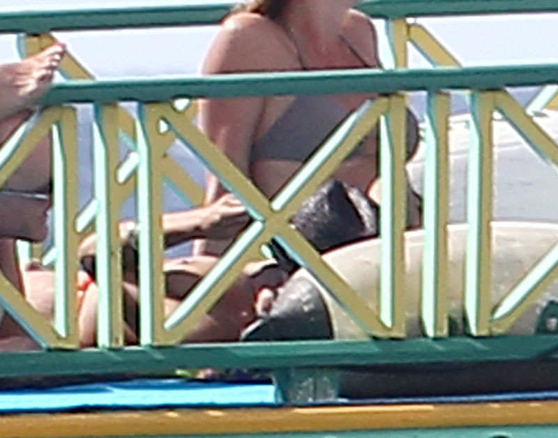 Rosario Dawson Caught Topless Sunbathing