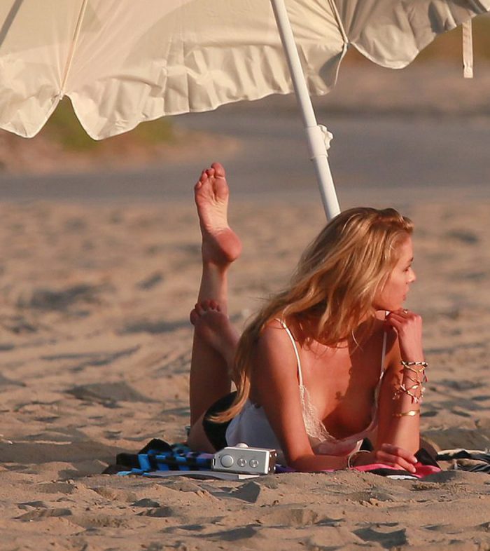 Stella Maxwell Nipple Slip on a Beach Photoshoot