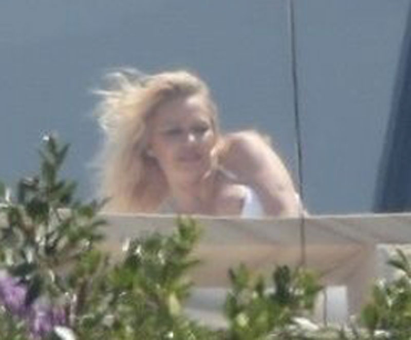 Pam Anderson Nipple Slip While Sunbathing in White Bikini