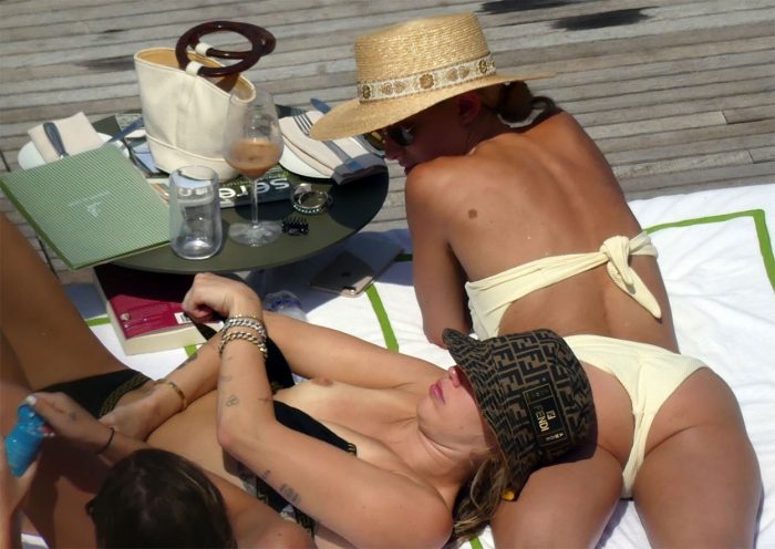 Miley Cyrus Topless Sunbathing in Fendi