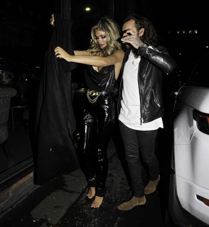 Chloe Sims has one of her Boobs Pop Out of her Silk Top