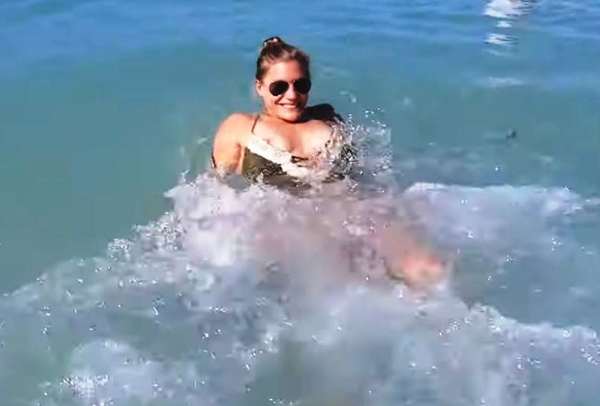 Katee Sackhoff has her nipple escape from her bikini top while in the ocean...