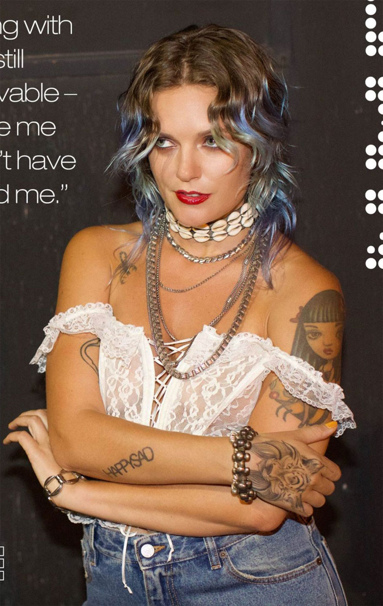 Tove Lo Posing Braless in White Lace Corset