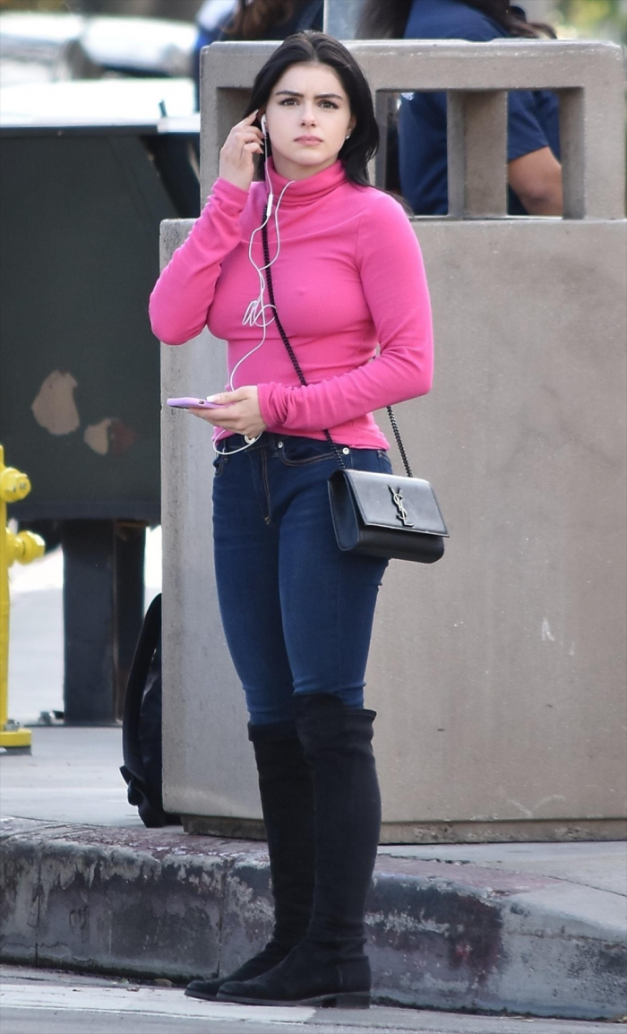 Ariel Winter Sweater Puppy Pokies in a Pink Turtleneck
