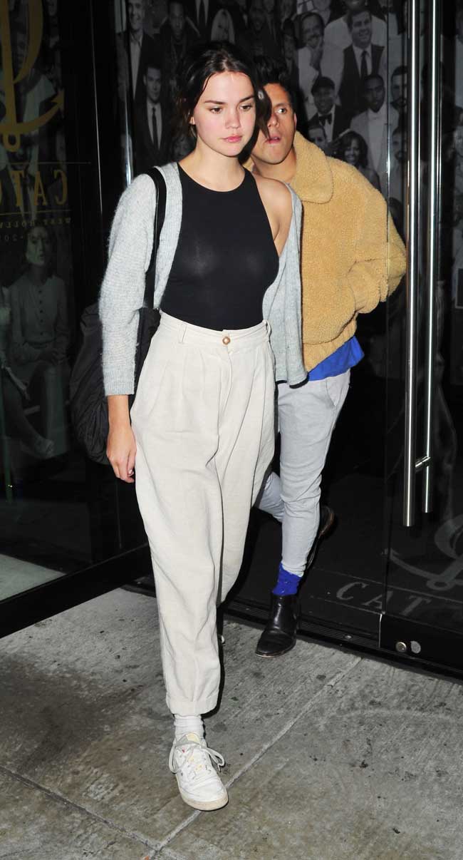 Maia Mitchell No Bra in a Sheer Black Bodysuit