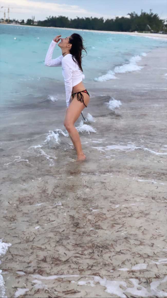 Sarah Shahi Frolics in the Surf Showing off her Perky Pokies