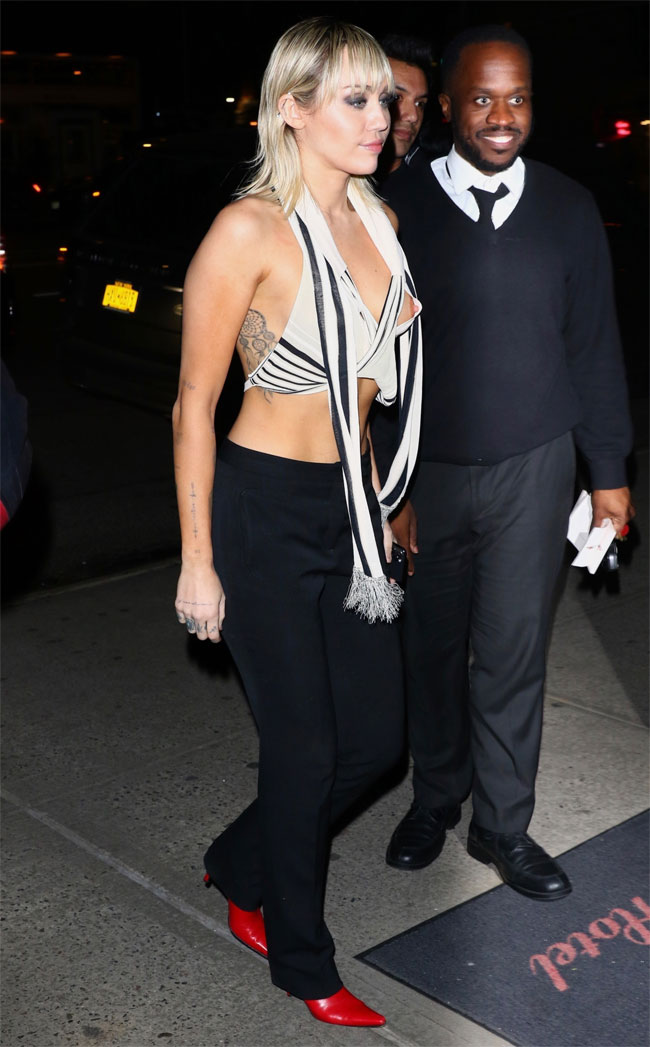 Miley Cyrus Has a Nipple Exposed in White Vest