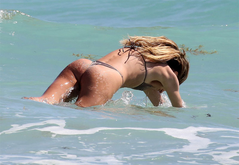 Candice Swanepoel Wearing a Tiny Bikini at the Beach