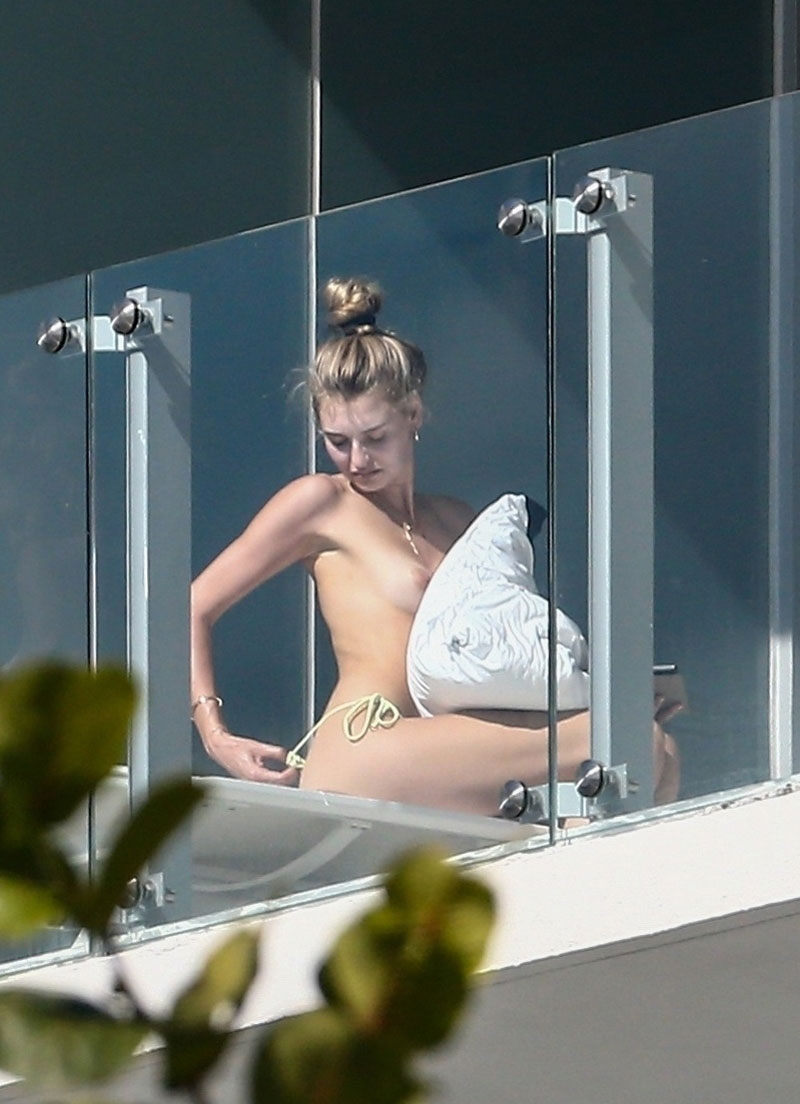 Model Roosmarijn de Kok caught on a hotel balcony in Florida topless sunbat...