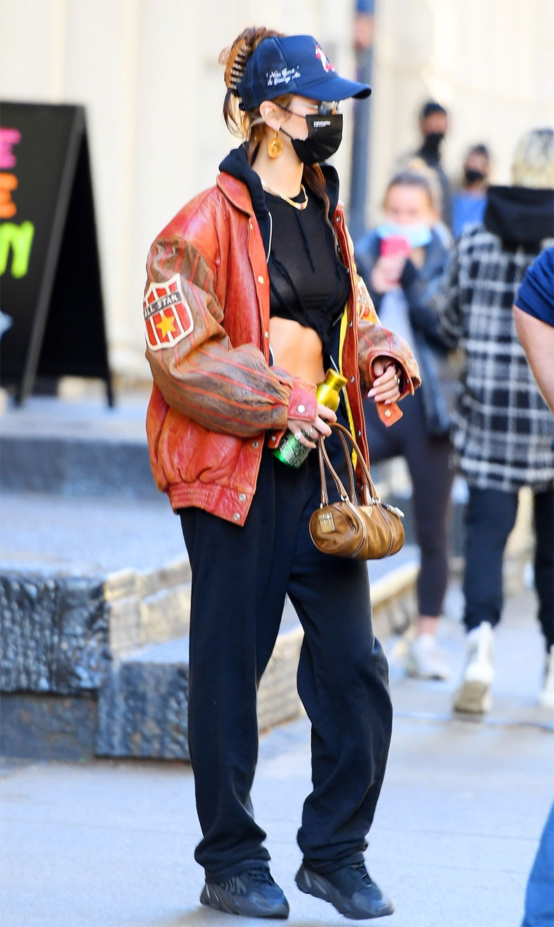 Bella Hadid Braless in Black Top & Leather Jacket