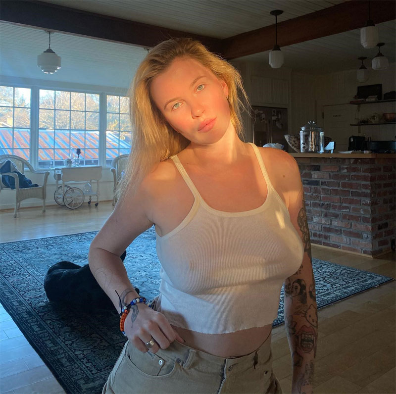 Ireland Baldwin Braless Pokies in White Tank Top