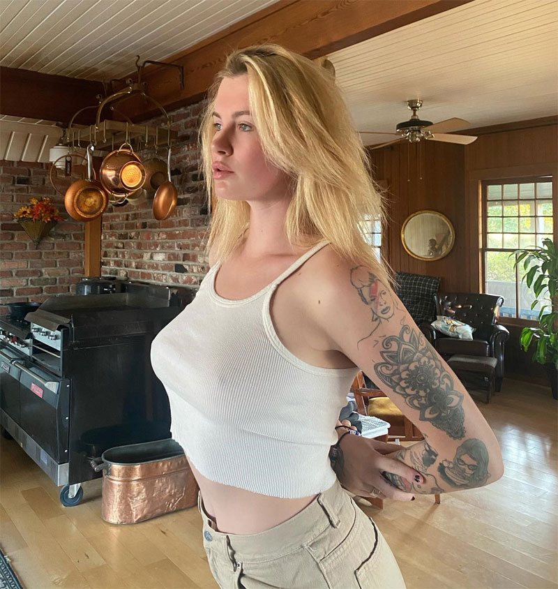 Ireland Baldwin Braless Pokies in White Tank Top