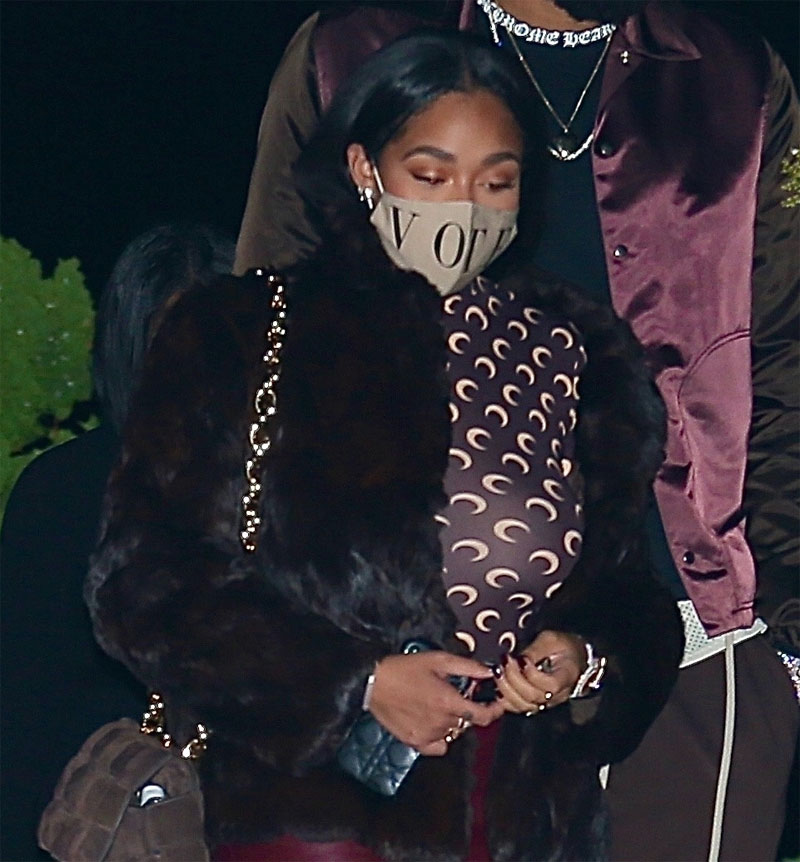 Jordyn Woods Braless in a Sheer Black Top and Leather Jacket