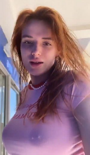 Bella Thorne Nipple Piercing in a Pink Top