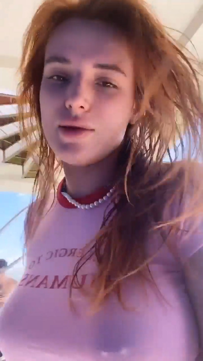 Bella Thorne Nipple Piercing in a Pink Top