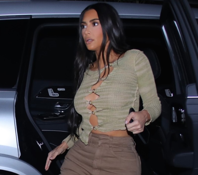 Kim Kardashian Braless in an Open Button Sweater