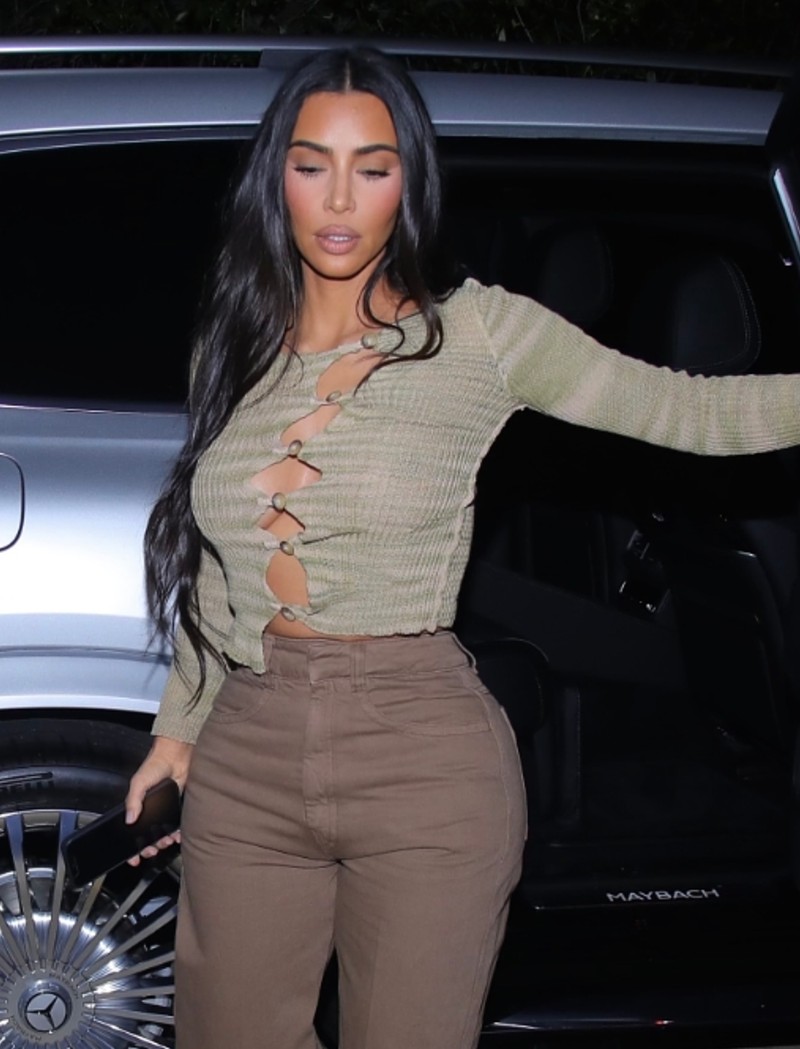 Kim Kardashian Braless in an Open Button Sweater
