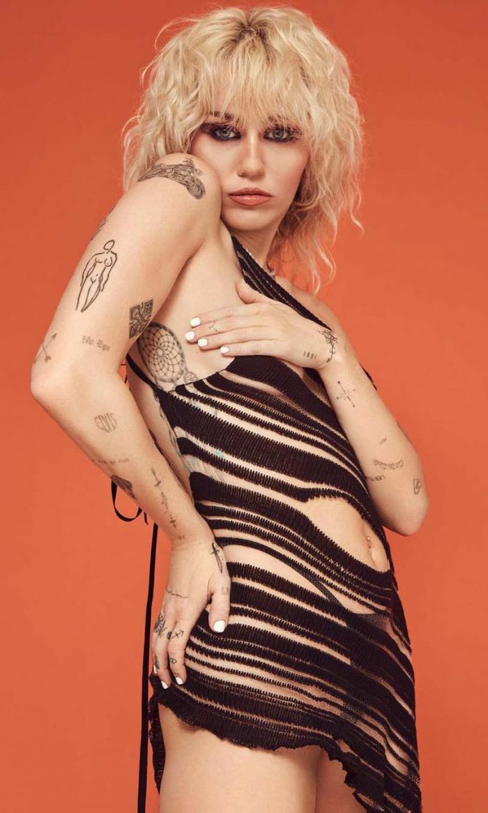 Miley Cyrus Seductive Pose In A See-Through Dress